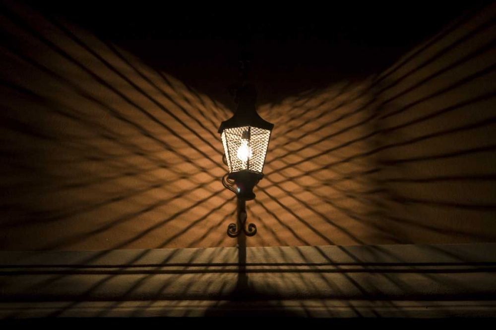 Mexico Wire cage lamp at night creates shadows